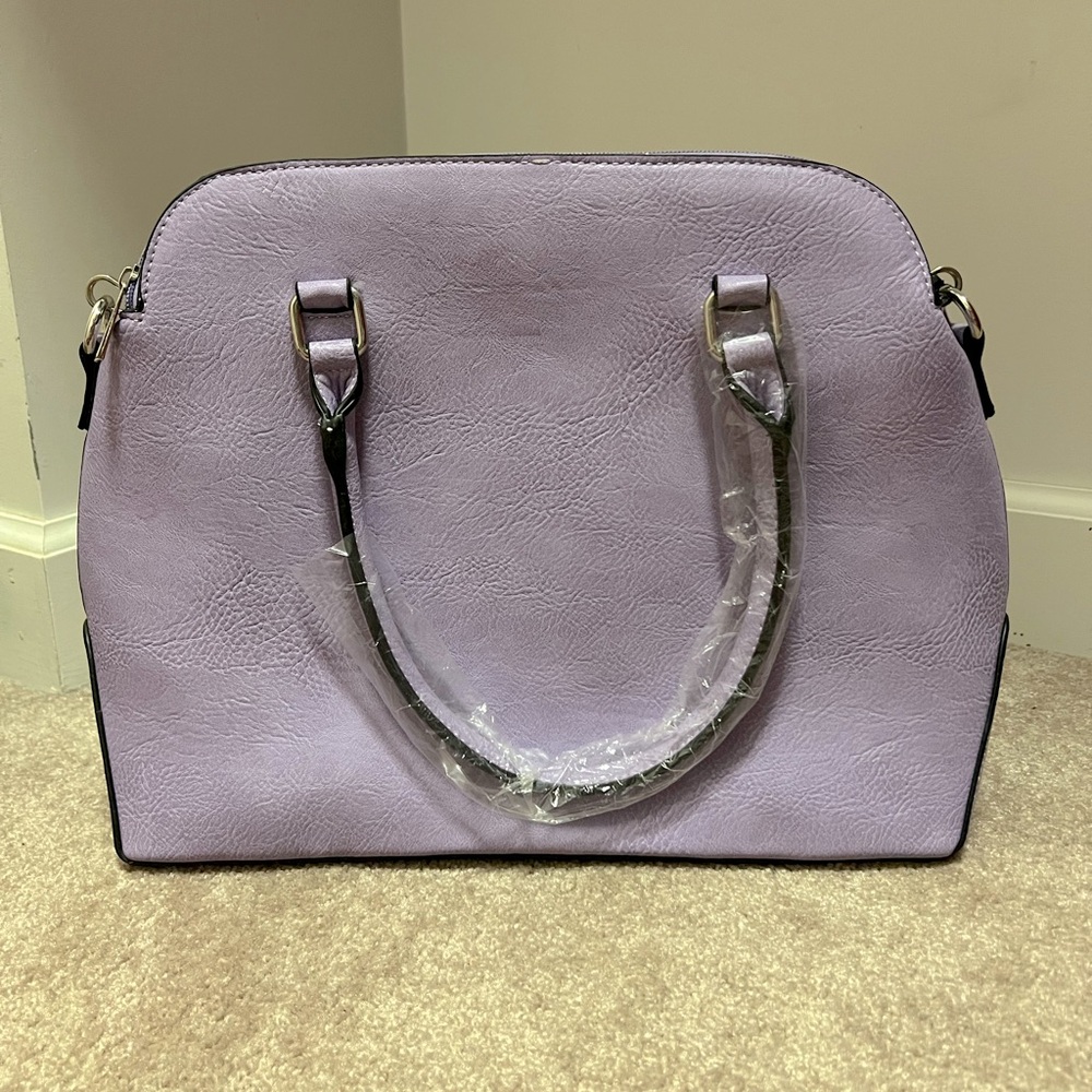 Purple purse with elbow straps.